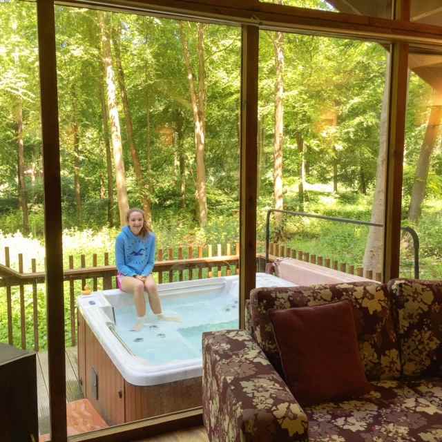 Many of the Forest Holidays cabins come with a hot tub in the outdoor patio.