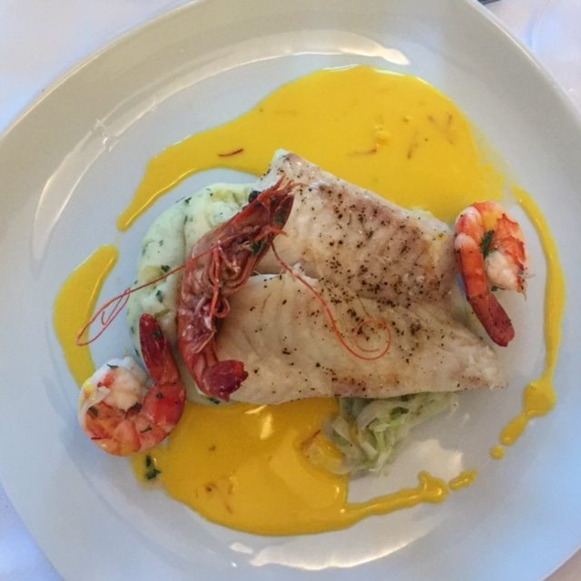 The food at @Tregarthen's combines fresh local produce with some serious culinary talent. Pan fried brill, lemon and herb mash, buttered leeks, tiger prawns in a saffron buerre blanc