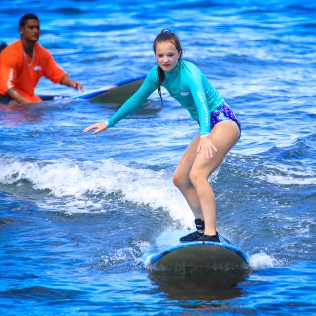 Under the watchful eye of her Ka'anapali Surf Club instructor, Anoai, middle daughter catches her first wave of the day! Thanks to @farmingsurfer for taking this awesome pic